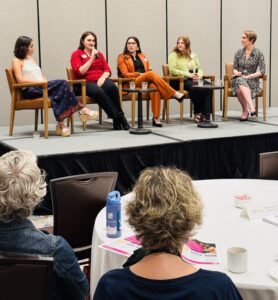 Panelists with host Katrina Noelle on a Customer Voice Keynote